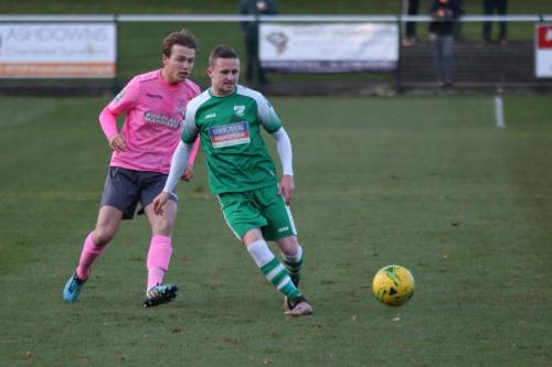 Leatherheads Tom Richards (R) plays the ball under pressure from Mickey Parcell