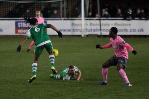 Leatherheads Yannis Ambroisine (6) and  Sammy Moore combine to deny Ryan Blake