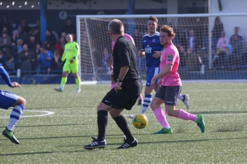 Aaron Greene (Enfield) finds his way blocked by the referee