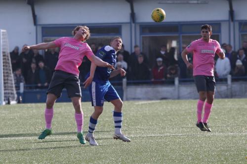 Enfields Aaron Greene (L) challenges Dave Martin