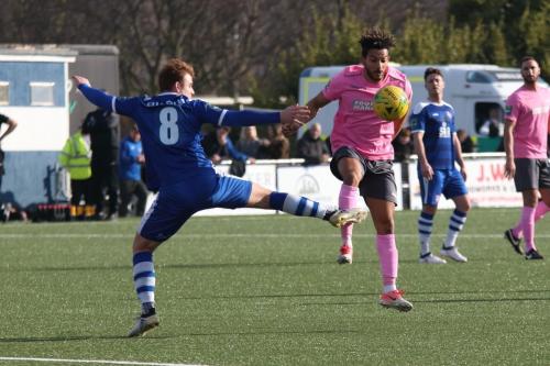 Enfields Tyler Campbell (R) controls the ball despite a desperate lunge from Sam Blackman