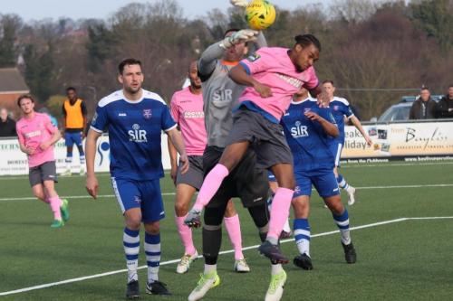 Margate keeper Lenny Pidgeley briefly loses the ball under challenge from Dernell Wynter but is able to recover