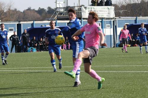 Margates Jack Evans (blue) and Enfields Aaron Greene