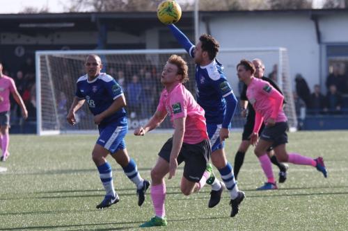 Margates Jack Evans blue, R) appeals successfully for offside against Aaron Greene