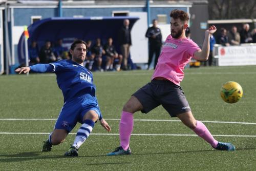 Margates James Rogers (L) clears from Jack Hockney