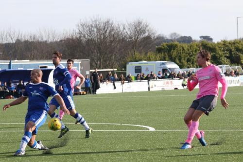 Margates Tom Wynter (L) blocks a shot from Sam Youngs
