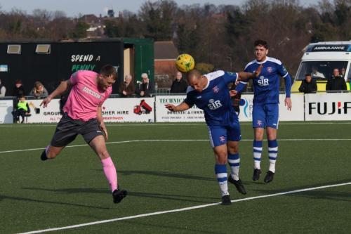 Margates Tom Wynter (blue) heads clear from Brad Wadkins