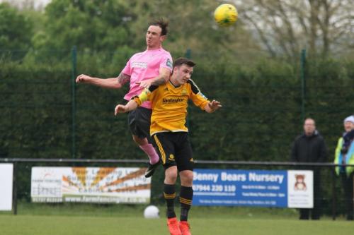 Enfields Brad Wadkins (L) wins a header against Ben Harrison