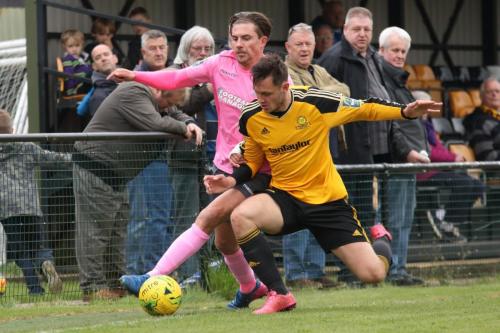 Enfields Sam Youngs (L) and Mersthams Ben Harrison