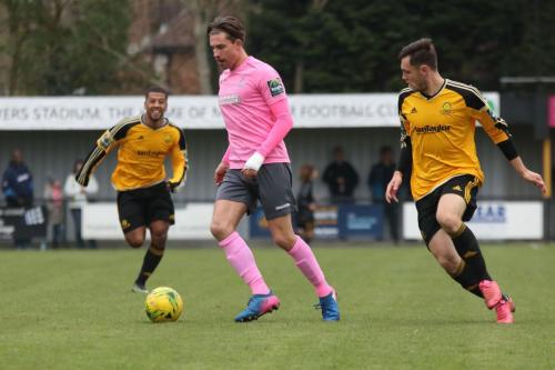 Enfields Sam Youngs and Mersthams Ben Harrison (R) and Reece Hall