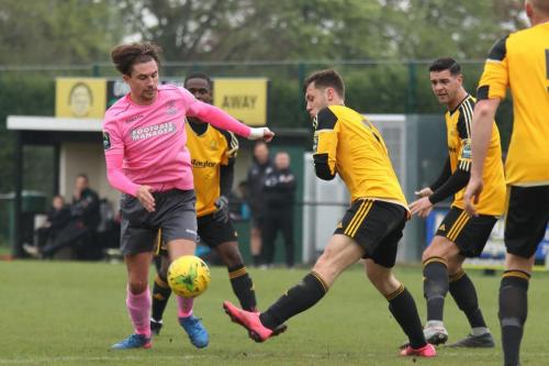 Mersthams Ben Harrison (amber) clears from Sam Youngs