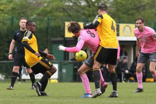 Mersthams Kershaney Samuels (L) and Tom Kavanagh and Enfields Sam Youngs