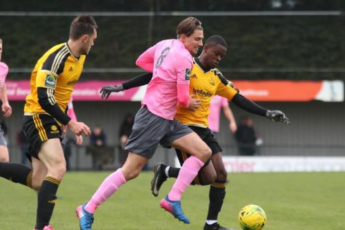 Mersthams Kershaney Samuels (L) challenges Sam Youngs