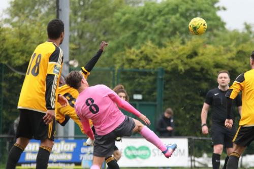 Mersthams Kershaney Samuels (amber no 8) clears from Sam Youngs