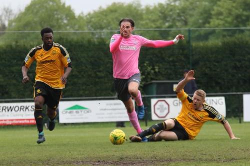 Mersthams Liam Harwood (R) appears to catch Sam Youngs who keeps his footing and shoots just wide
