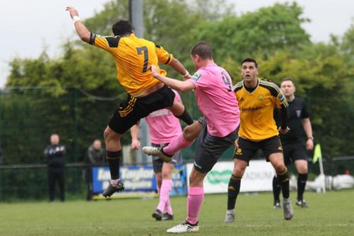 Mersthams Michael Abnett (7) clears from Liam Hope