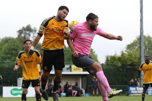 Mersthams Michael Abnett (amber) challenges Adam Martin  The ball falls to Dan Rumens for Enfields last-gasp equaliser
