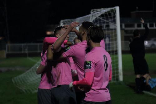 Enfield celebrate Brad Wadkins goal while refewree Neil Morrison calls for assistance for the injured Jamie Autorino