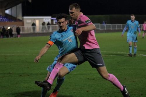 Mets Olli Robinson (L) and Enfields Brad Wadkins