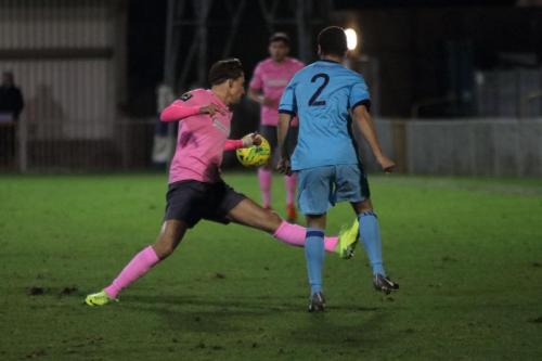 Mets Rylan Myers (blue) clears from Sam Youngs