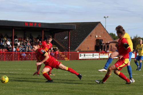 Enfields Aaron Greene (yellow) shoots