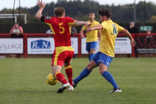 Enfields Drew Roberts (R) challenges Dan Morphew