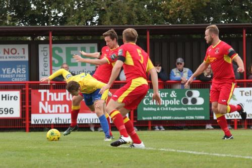 Enfields Mickey Parcell (yellow) is brought down in the box by Daryl Coakley, unnoticed by the officials