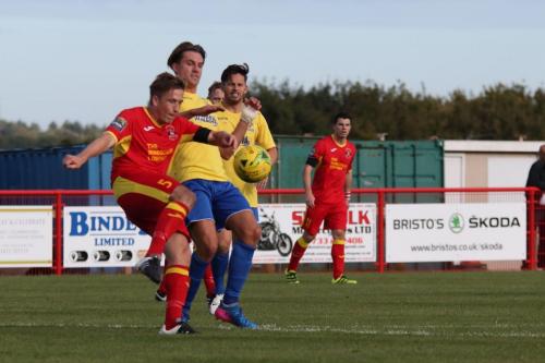 Needhams Dan Morphew (L) clears from Sam Youngs