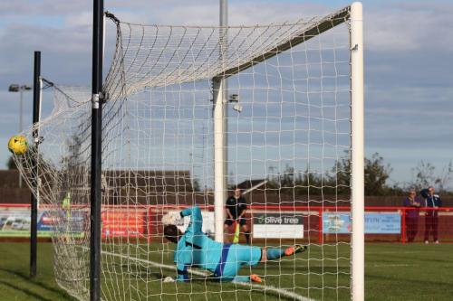Needhams Danny Gay is beaten by Jack Higgs free kick