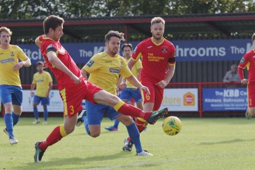 Needhams Daryl Coakley (3) deflects a cross past his own keeper204