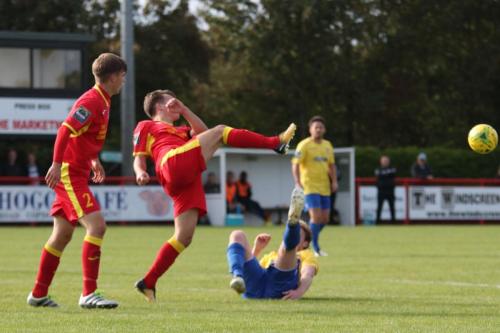 Needhams Jake Dye (L) and Callum Harrison and Enfields Aaron Greene