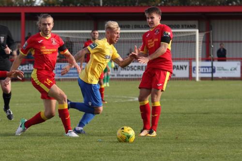Needhams Kieran Morphew (L) and Callum Harrison and Enfields Ryan Blackman