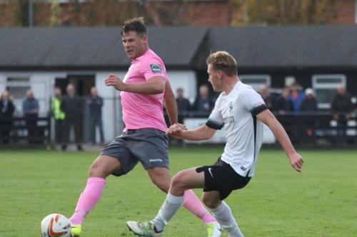 Enfields Adam Martin (L) and Roystons Gus Scott-Morriss