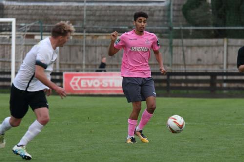 Enfields Montell Moore (R) and Roystons Gus Scott-Morriss