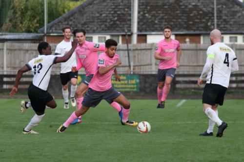Enfields Montell Moore spins away from Martel Powell