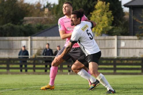 Enfields Taylor McKenzie (L) and Roystons Adam Murray jostle for position