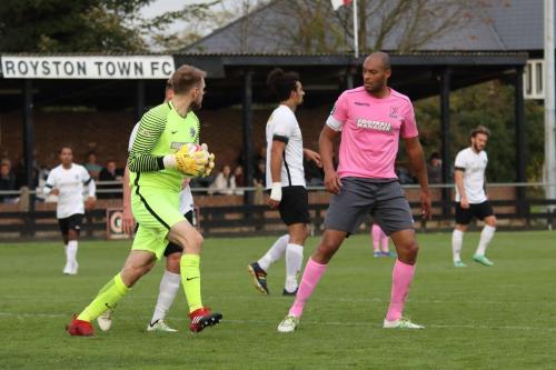 Royston keeper Joe Welch and Enfields Simon Thomas