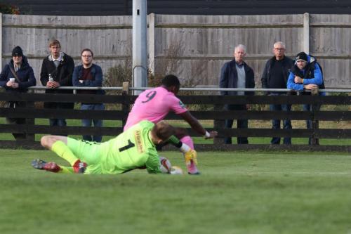 Royston keeper Joe Welch saves at the feet of Ryan Blake  Both players needed treatment as a result