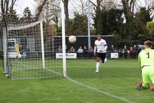 Royston keeper Joe Welch tips a shot round the post