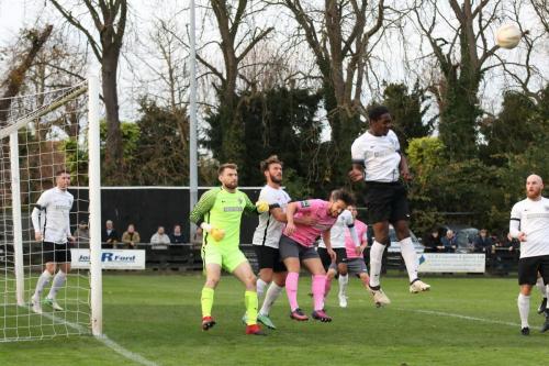 Roystons Ed Asafu-Adjaye heads clear at a set piece