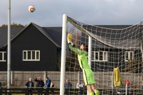 Roystons Joe Welch tips a long free kick from his opposite number Joe Wright over the bar