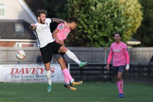 Roystons Scott Thomas (L) and Enfields Montell Moore