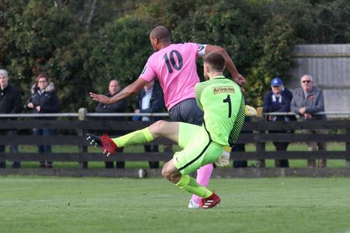 Simon Thomas charges down a clearance from Royston keeper Joe Welch but the ball falls safe