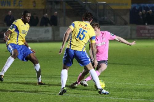 Aaron Greene (pink) beats Greg Haydon before scoring the second Enfield goal