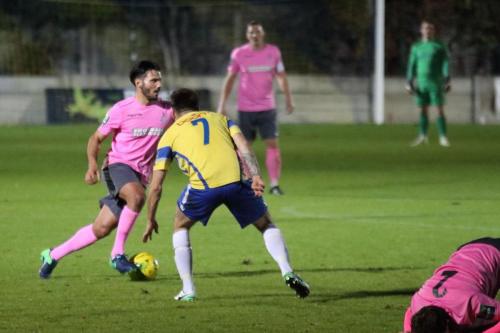 Enfields Mario Noto (L) cuts inside Lewis Driver