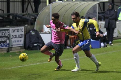 Enfields Montell Moore (L) and Staines Josh Webb
