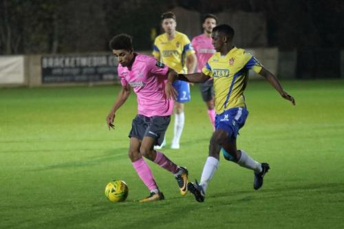 Enfields Montell Moore (L) and Staines Wadah Ahmidi