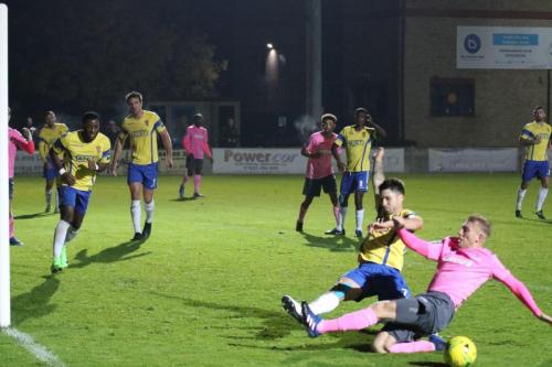 Enfields Ryan Blackman (R) and Staines Lewis Driver slide in but cant make contact