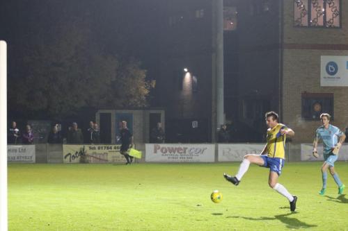 Staines Ben Martin gets back in time to clear a lob from Drew Roberts
