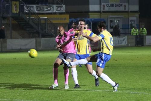Staines Greg Haydon (R) clears from Simon Thomas
